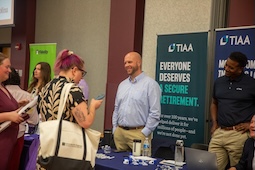 Vendor helping staff at expo