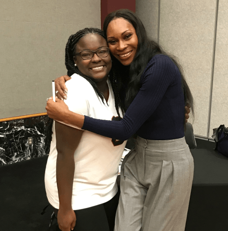 A student poses with Dominique Jackson