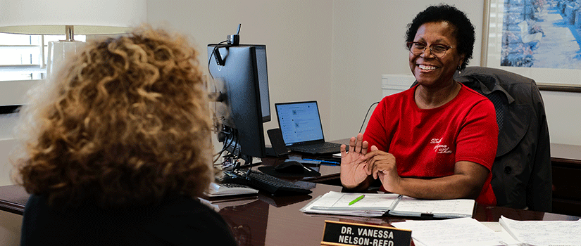 Vanessa Nelson-Reed, director for proposal development, assists a faculty member with her proposal.