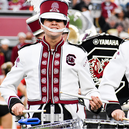 Drummer in USC Band uniform performs.