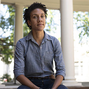 woman with a blue jean shirt on outside 