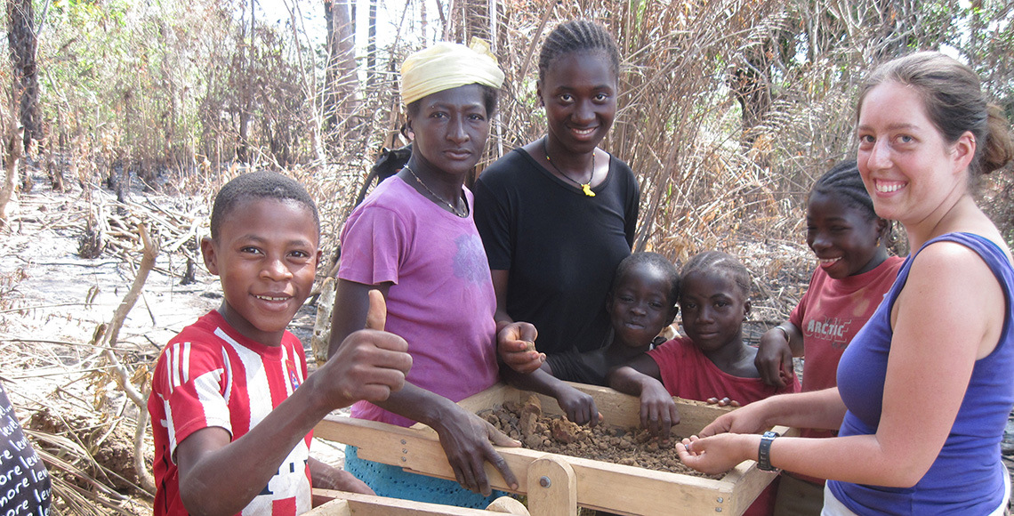 Student in West Africa with members of the community.