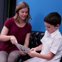 student working with a child