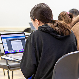 student at a laptop computer 