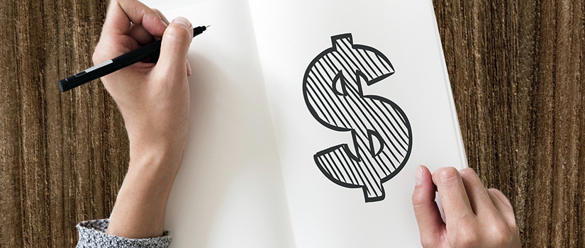 a hand holding a marker and a sketchbook. A dollar sign has been drawn in marker.