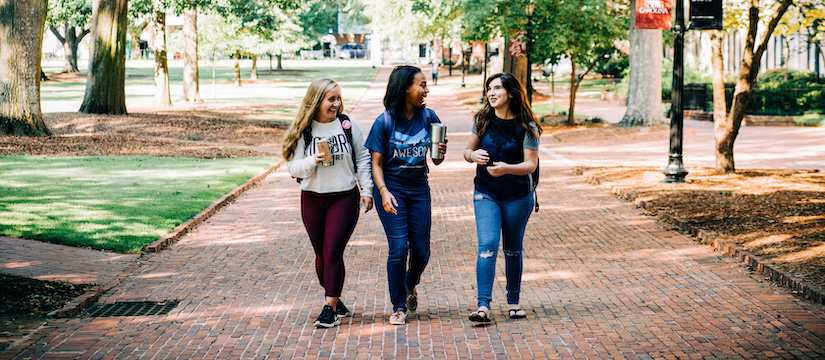 students waving