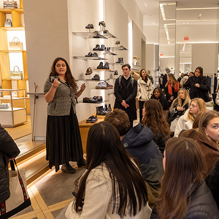 Students listen to a representative at Dior in New York City