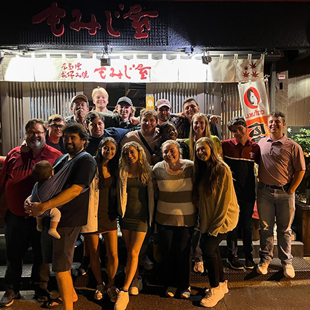 Students on a trip to Japan for a study abroad trip pose for a photo