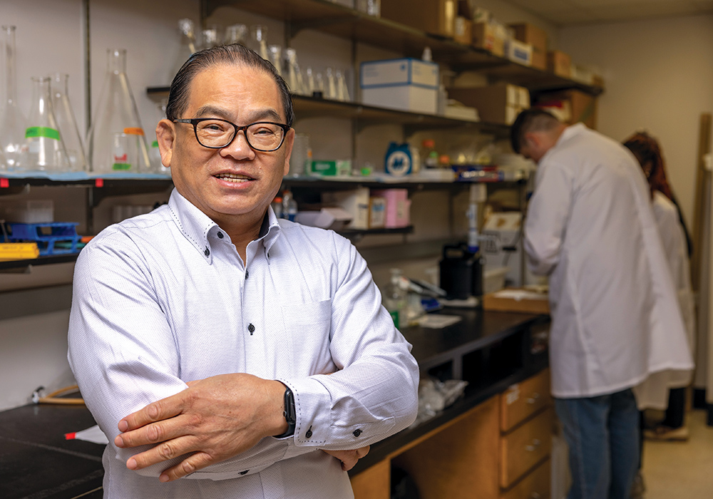 Pharmacy professor Jun Zhu in his lab.