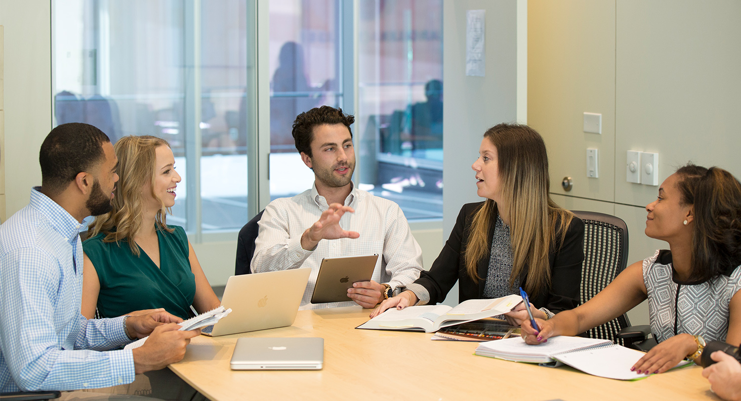 Five students participate in a discussion at the Darla Moore School of Business.