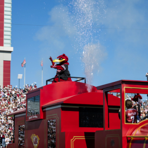 Cocky entering Williams-Brice Stadium on the train and Cockaboose.