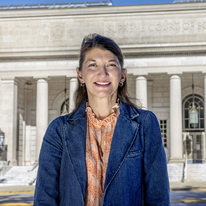 College of Social Work professor Stephanie Hunter stands across from the South Carolina Supreme Court building.