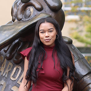 Amber Devine sits with Cocky statue Amber Devine sits with Cocky statue
